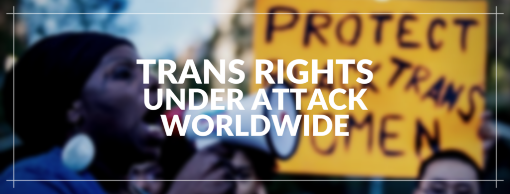 Text 'Trans Rights Under Attack Worldwide' with a demonstration for trans people rights in the background