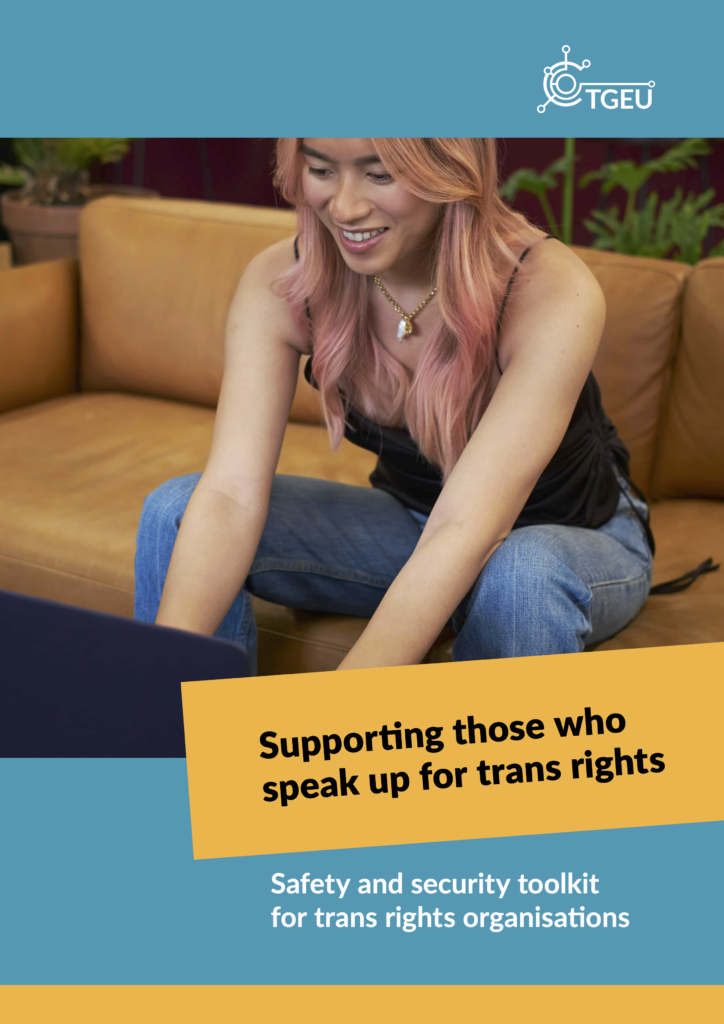 'Supporting Those Who Speak Up for Trans Rights: Safety and Security Toolkit for Trans Rights Organisations' cover, depicting a trans person smiling, as they write on their notebook.