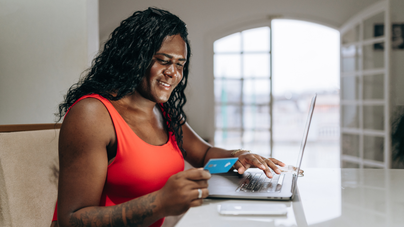 A trans feminine person banking online.