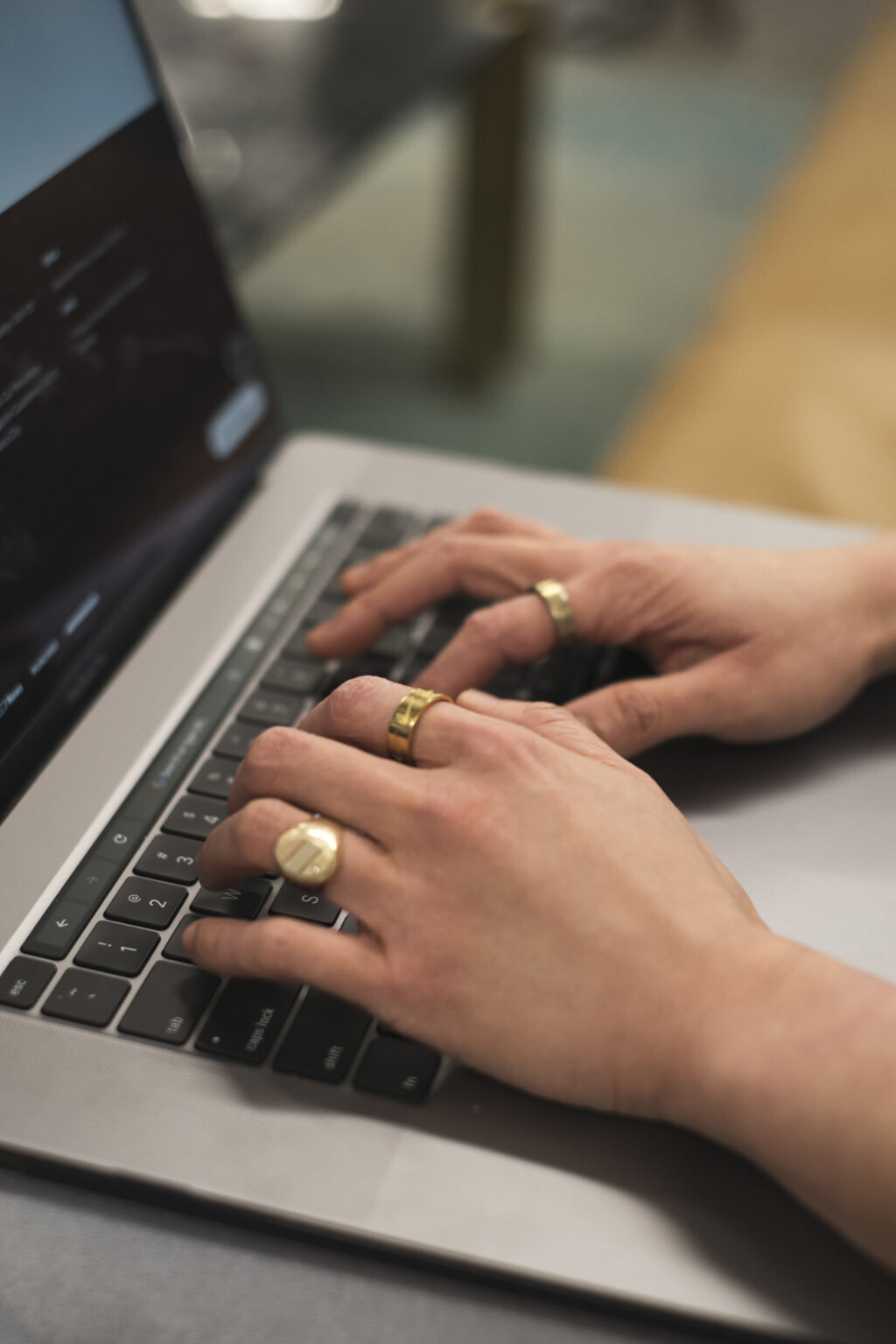 Close-up of a non-binary person using a laptop