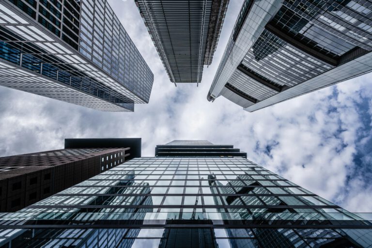 frog-eye view of high glass buildings